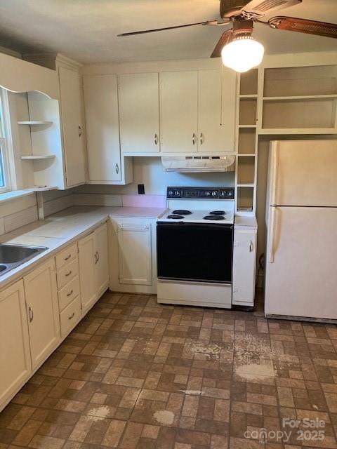 6700 Sisk-Carter Road Rockwell, NC 28138 - Photo 5 of 26 a kitchen with stainless steel appliances granite countertop a stove a sink and a refrigerator