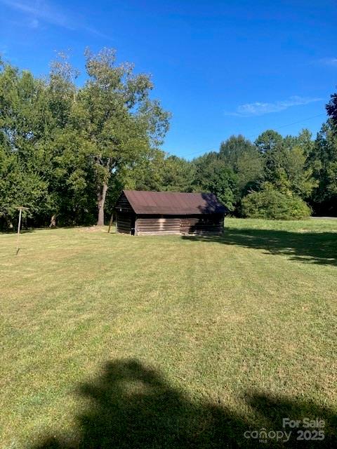 6700 Sisk-Carter Road Rockwell, NC 28138 - Photo 9 of 26 a swimming pool with trees in the background