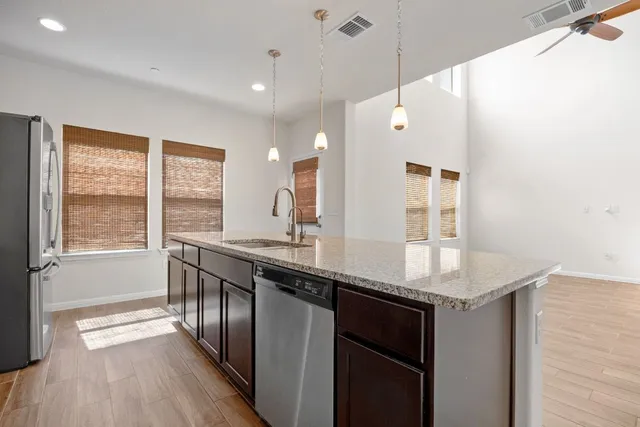 a kitchen with a sink and a large window