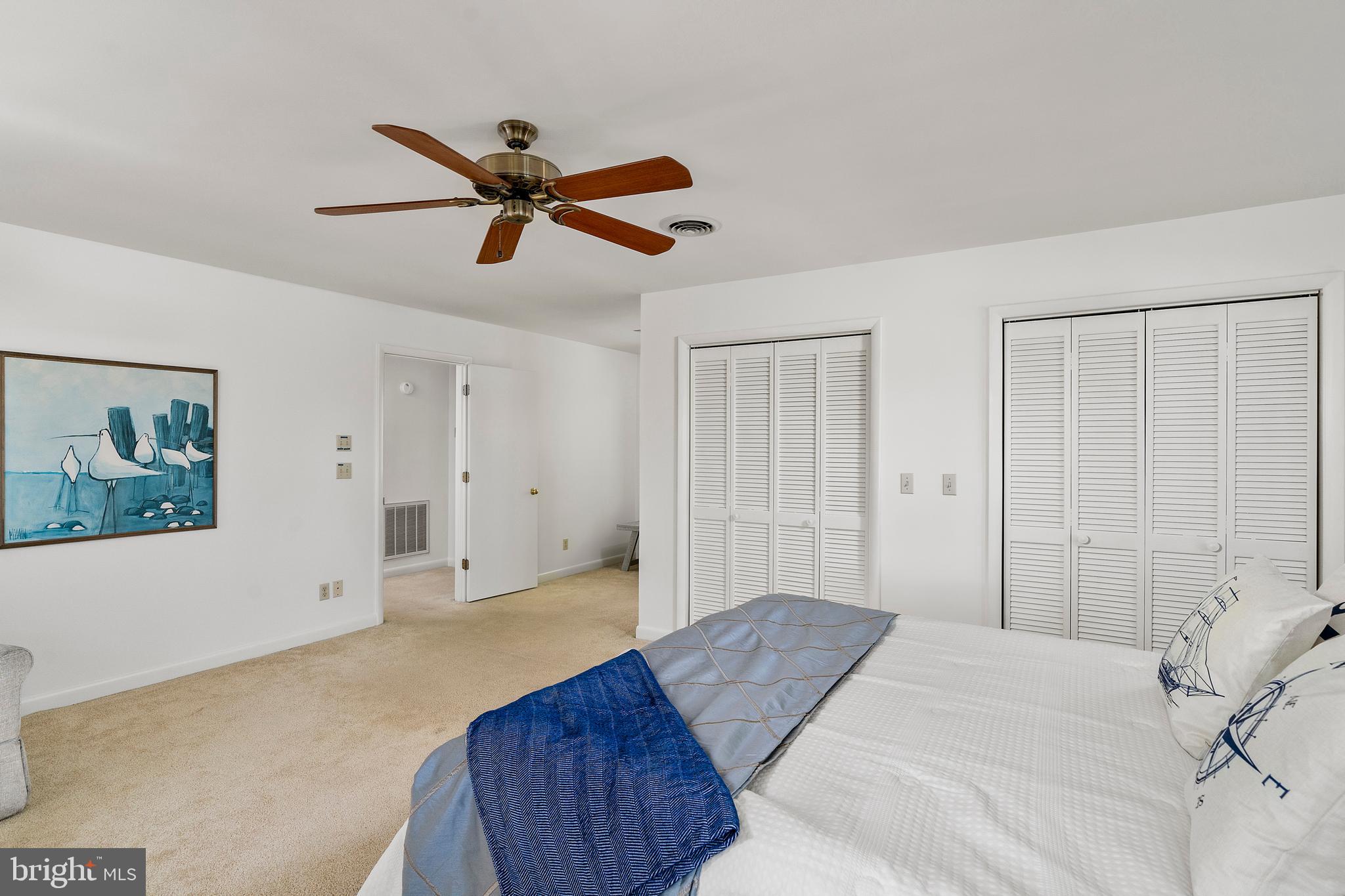 1077 Level Green Road Lancaster, VA 22503 - Photo 28 of 66 Primary bedroom with two large closets