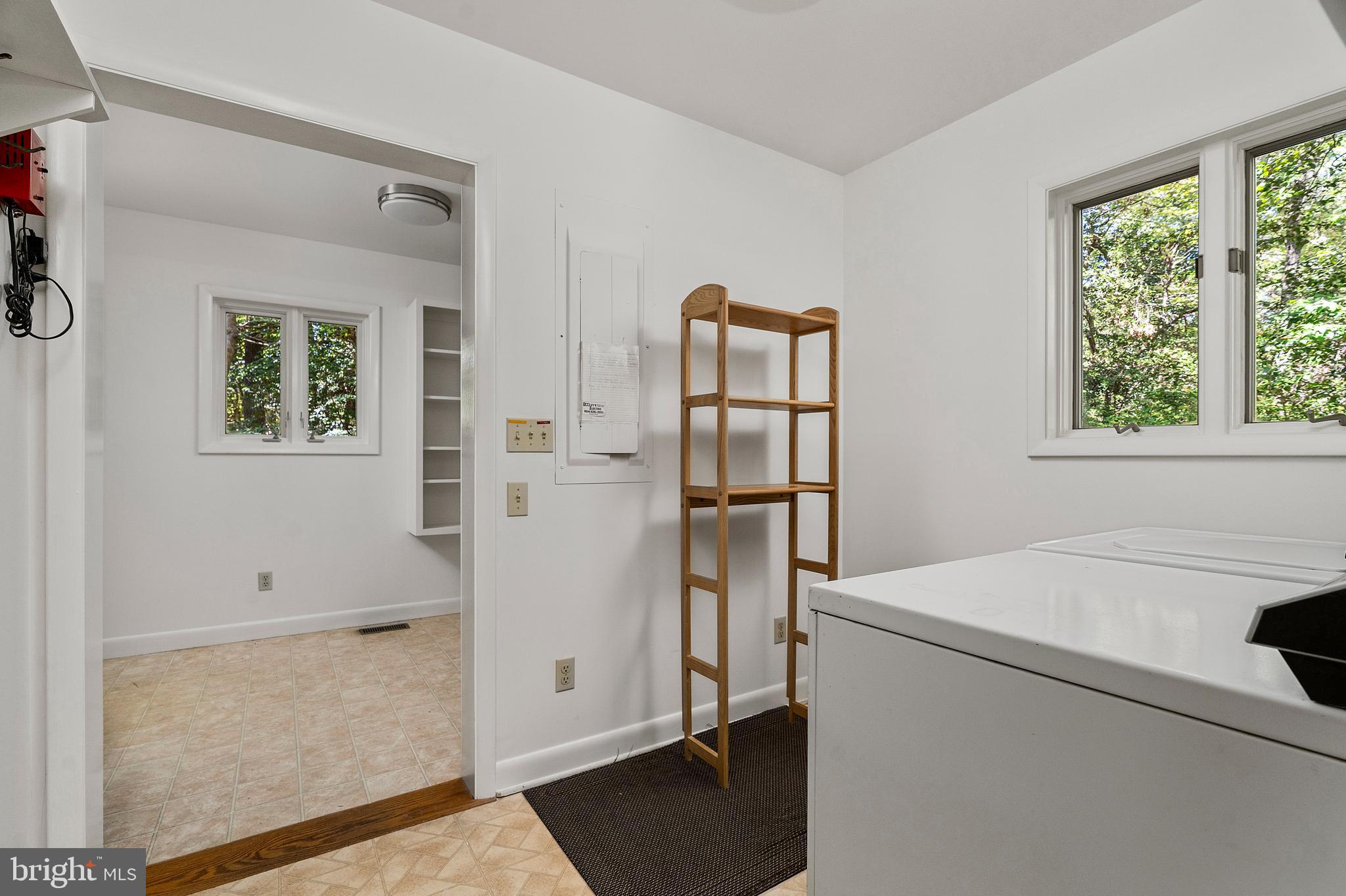 1077 Level Green Road Lancaster, VA 22503 - Photo 42 of 66 Laundry opens s to mud room with tons of built-ins