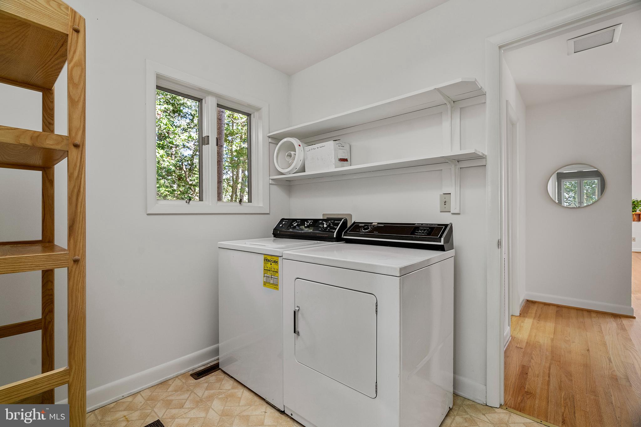 1077 Level Green Road Lancaster, VA 22503 - Photo 43 of 66 Large laundry room on main level with shelving