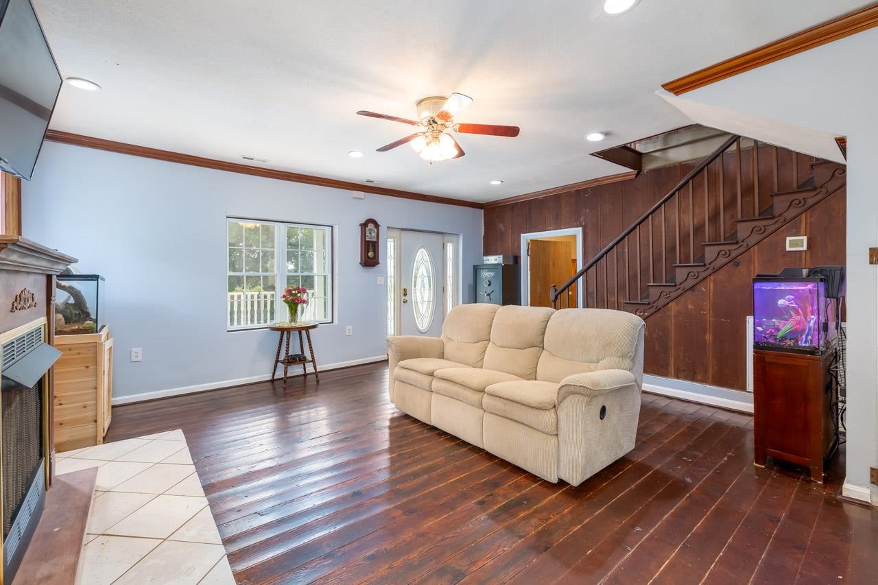 4147 South Middle Road Quicksburg, VA 22847 - Photo 12 of 33 a living room with furniture and a fireplace