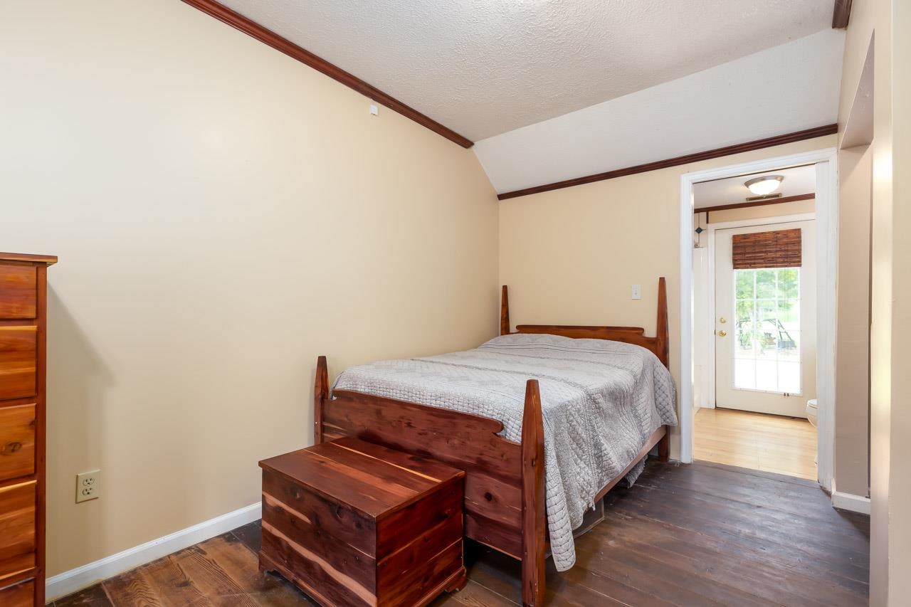 4147 South Middle Road Quicksburg, VA 22847 - Photo 13 of 33 a bedroom with a bed and wooden floor