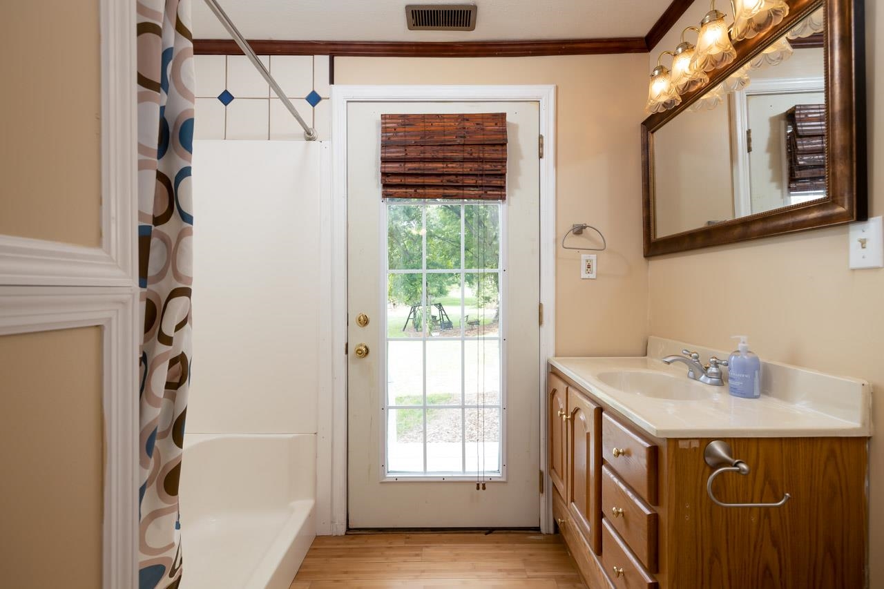 4147 South Middle Road Quicksburg, VA 22847 - Photo 15 of 33 a bathroom with a sink a mirror and a shower