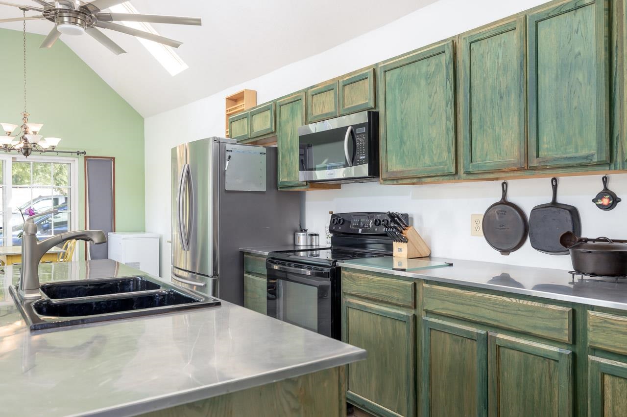 4147 South Middle Road Quicksburg, VA 22847 - Photo 4 of 33 a kitchen with stainless steel appliances a sink a stove cabinets and a refrigerator
