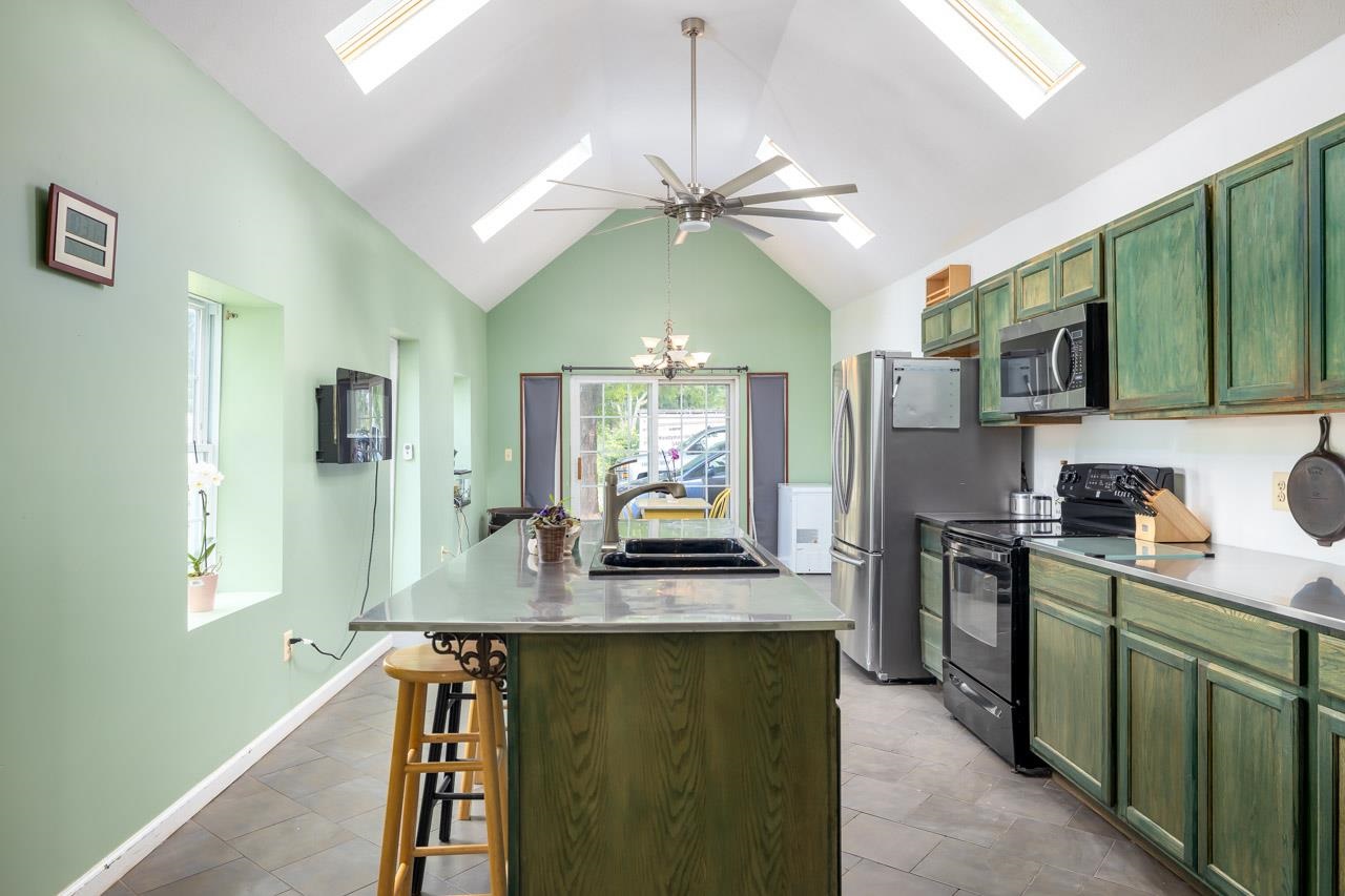 4147 South Middle Road Quicksburg, VA 22847 - Photo 5 of 33 a kitchen with kitchen island granite countertop a stove and a sink