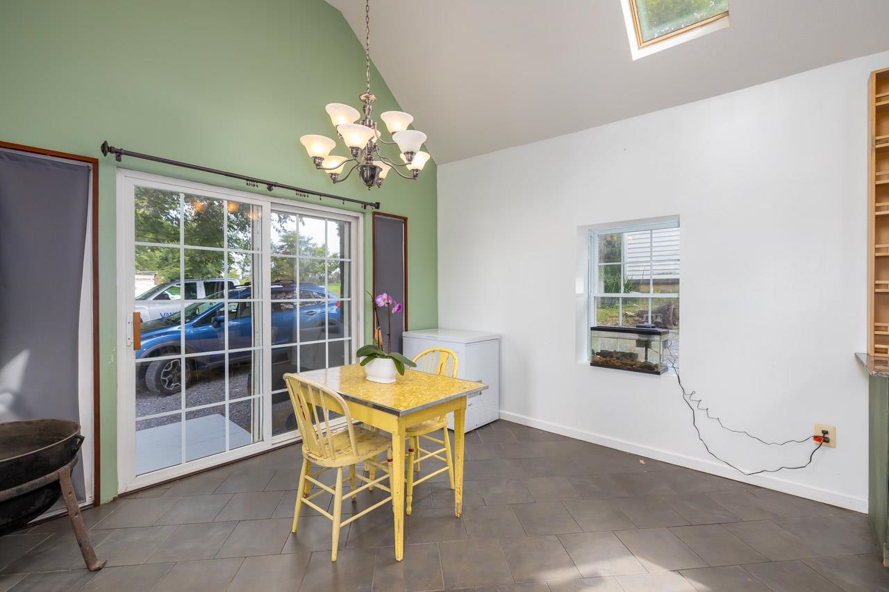 4147 South Middle Road Quicksburg, VA 22847 - Photo 7 of 33 a dining room with furniture and chandelier curtains
