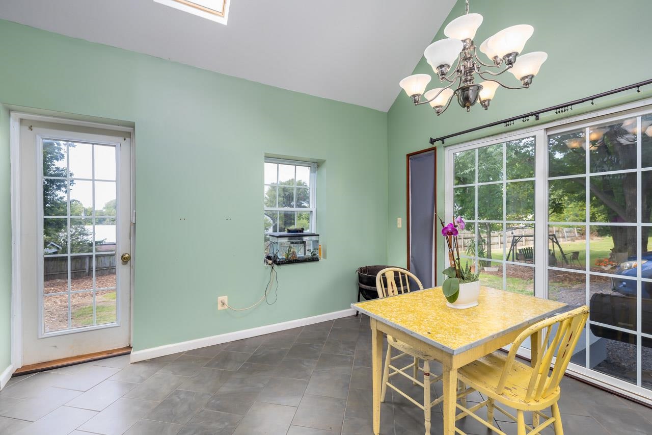 4147 South Middle Road Quicksburg, VA 22847 - Photo 8 of 33 a view of a dining room with furniture a chandelier and window