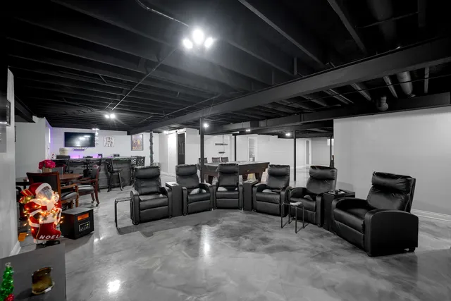 a living room with lots of furniture a chandelier