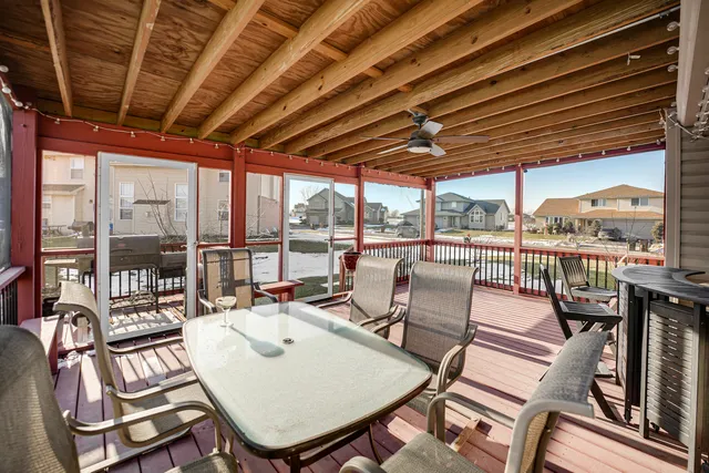 a view of a patio with a dining table and chairs