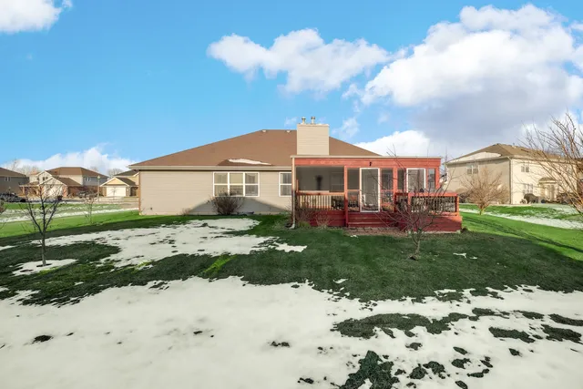 a view of a house with a backyard