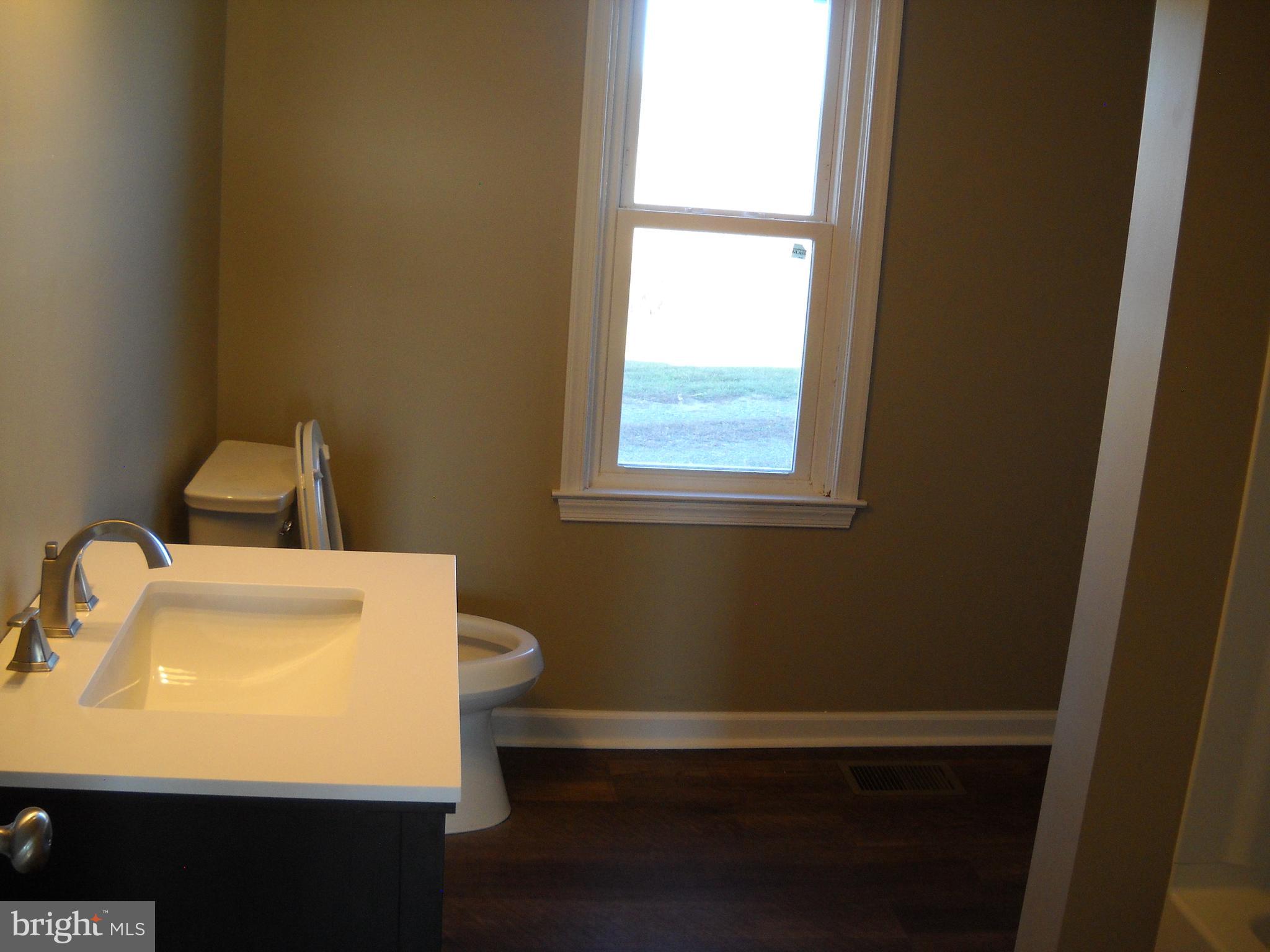 662 Passage Road Winchester, VA 22602 - Photo 9 of 13 a bathroom with a sink and a vanity