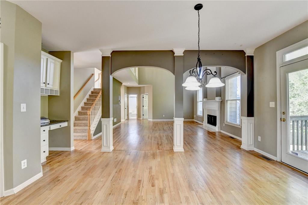 3407 Highland Forge Trail Dacula, GA 30019 - Photo 15 of 71 a view of a livingroom with wooden floor and staircase