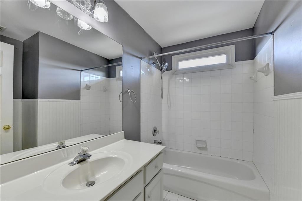 3407 Highland Forge Trail Dacula, GA 30019 - Photo 26 of 71 a bathroom with a bathtub shower sink vanity and a mirror