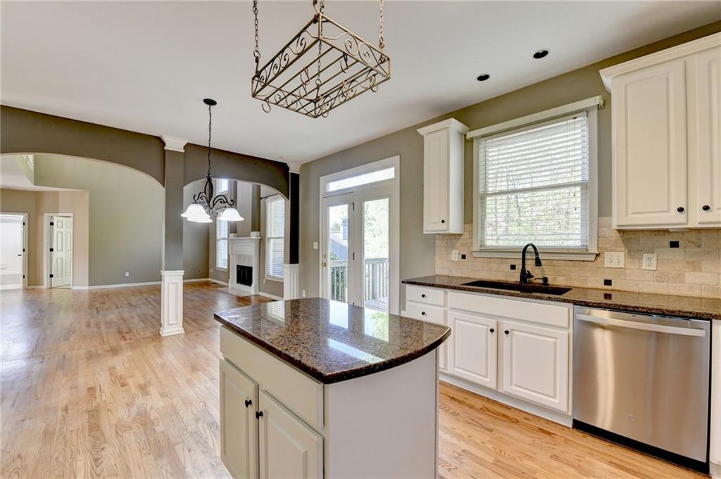 3407 Highland Forge Trail Dacula, GA 30019 - Photo 39 of 71 a kitchen with sink stove and cabinets
