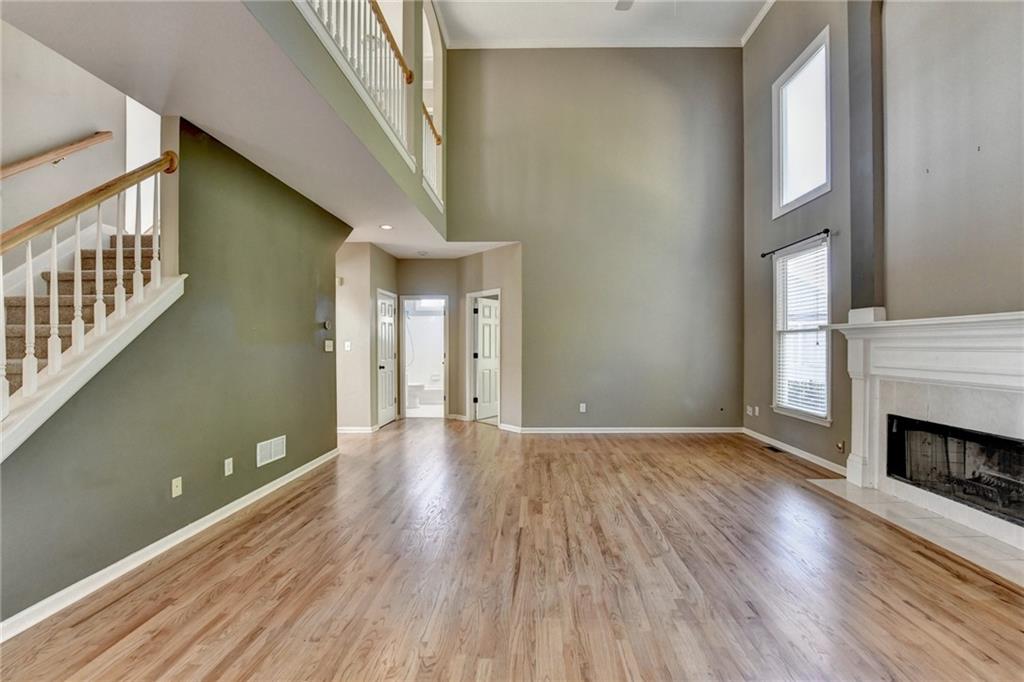3407 Highland Forge Trail Dacula, GA 30019 - Photo 40 of 71 a view of an empty room with wooden floor and a window