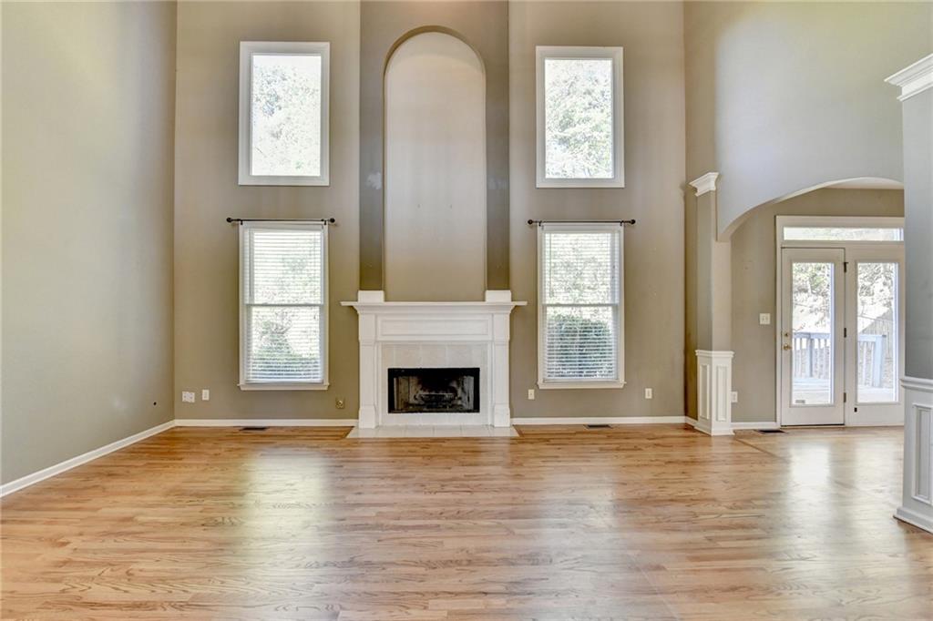 3407 Highland Forge Trail Dacula, GA 30019 - Photo 42 of 71 a view of an empty room with window and wooden floor