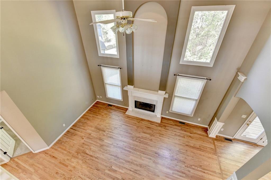 3407 Highland Forge Trail Dacula, GA 30019 - Photo 47 of 71 a view of a livingroom with wooden floor and staircase