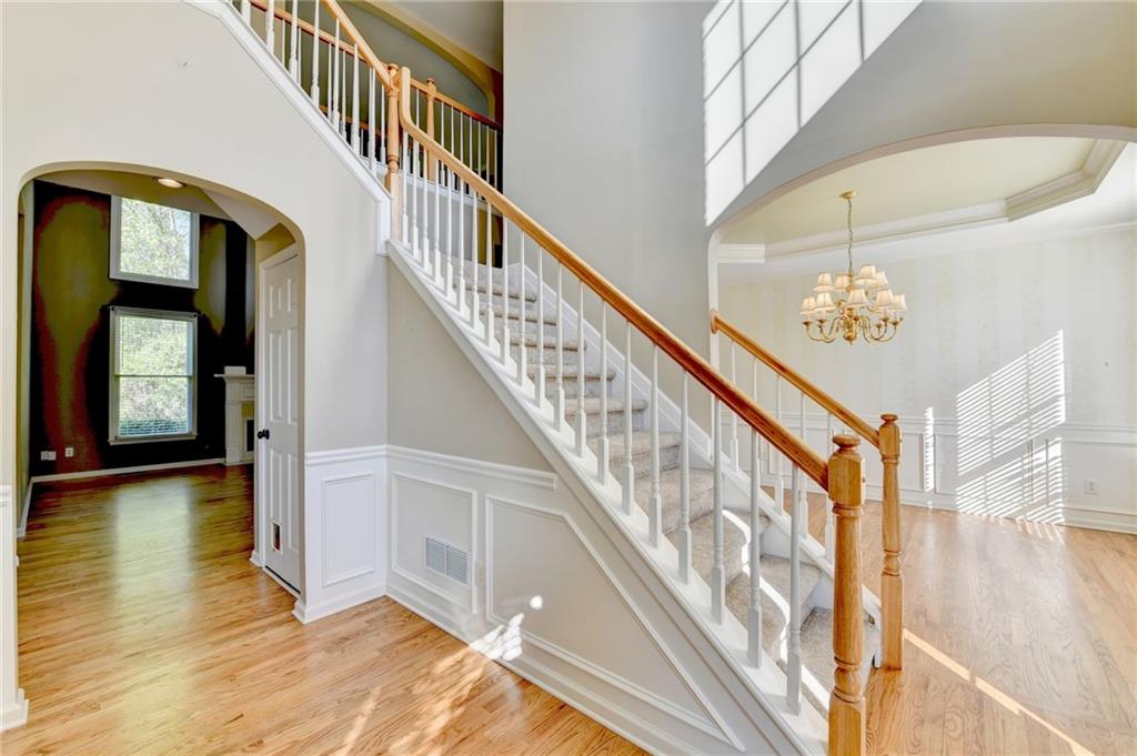 3407 Highland Forge Trail Dacula, GA 30019 - Photo 5 of 71 a view of staircase with railing and a chandelier