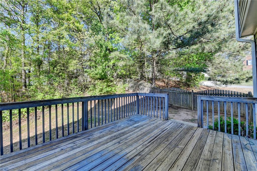 3407 Highland Forge Trail Dacula, GA 30019 - Photo 67 of 71 a balcony with wooden floor and fence