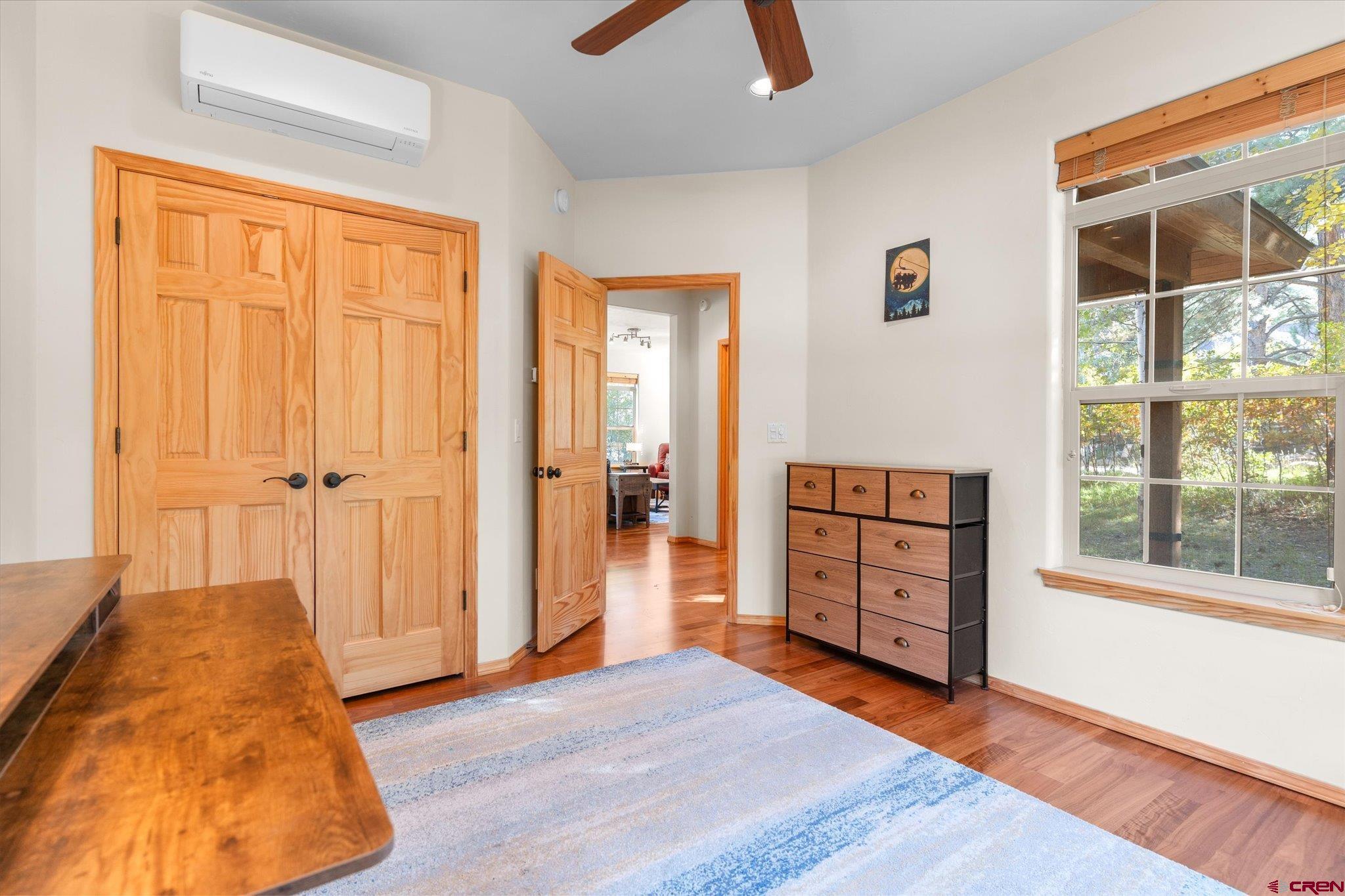73 Ute Pass Road Durango, CO 81301 - Photo 15 of 44 wooden floor in an empty room with a window