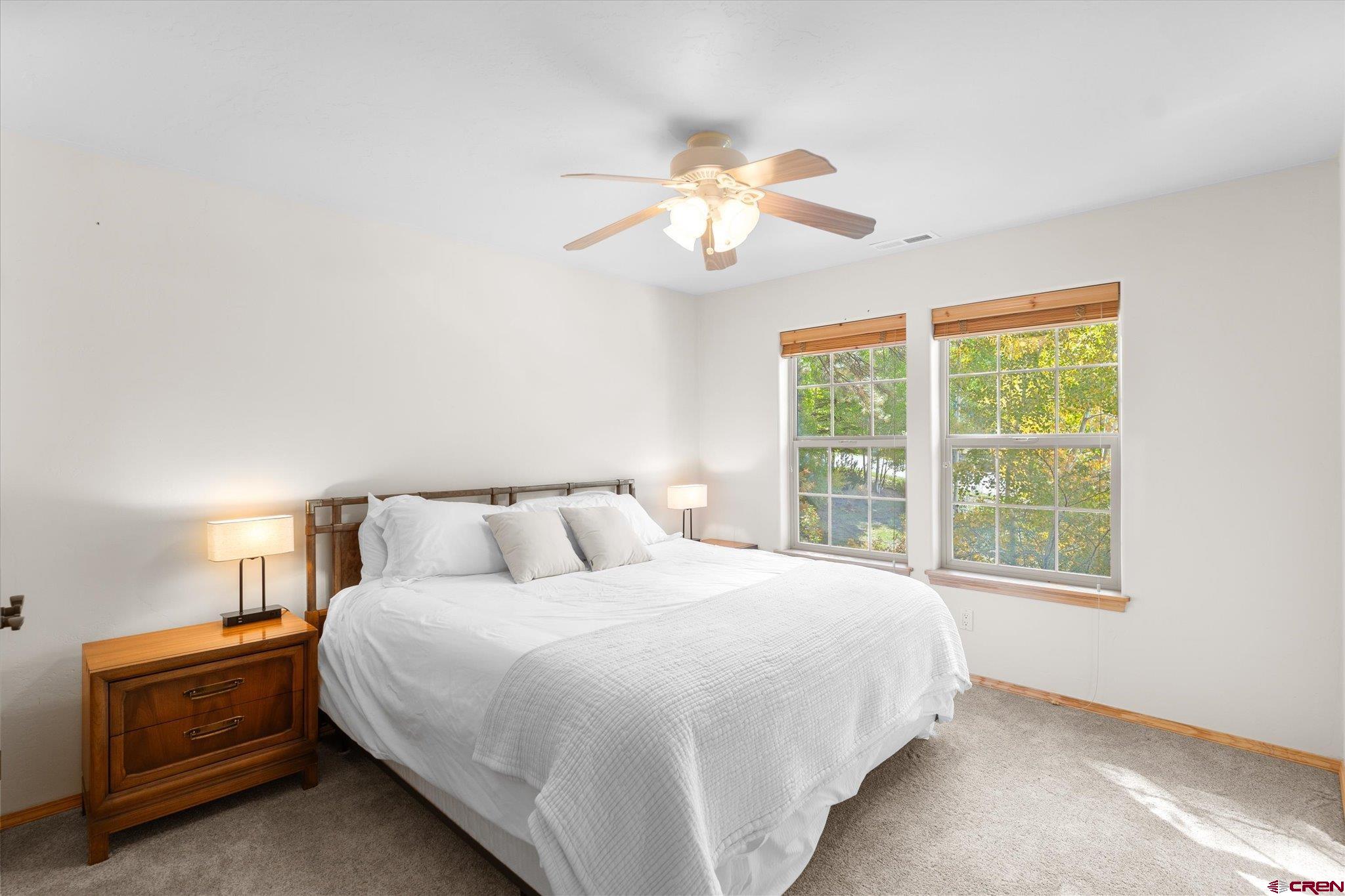 73 Ute Pass Road Durango, CO 81301 - Photo 30 of 44 a bedroom with a bed and a window