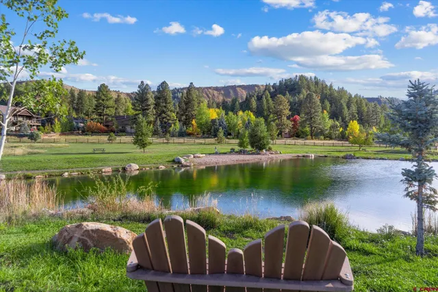 a view of a lake with a house in the background