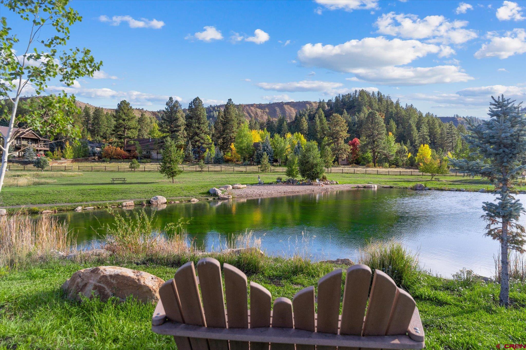 73 Ute Pass Road Durango, CO 81301 - Photo 3 of 44 a view of a lake with a house in the background