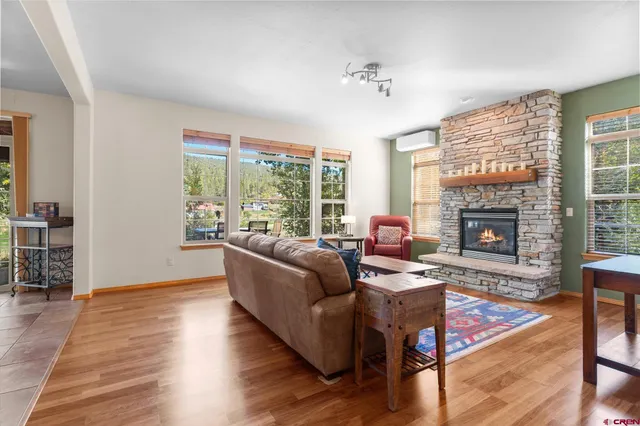 a living room with furniture and a fireplace