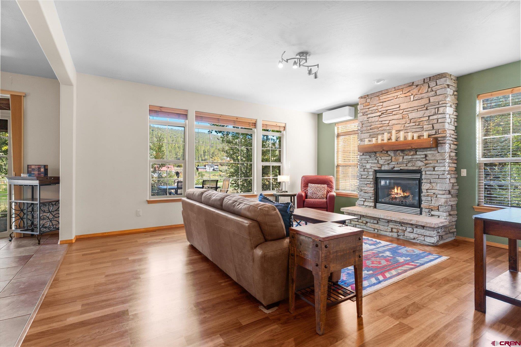 73 Ute Pass Road Durango, CO 81301 - Photo 5 of 44 a living room with furniture and a fireplace