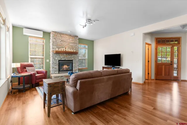 a living room with furniture and a fireplace