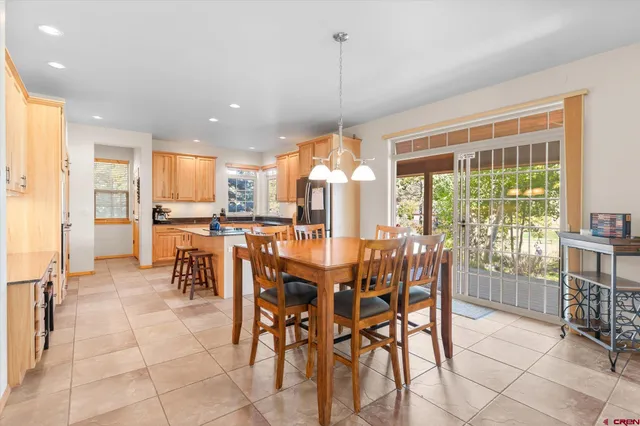 a view of a dining room with furniture window and outside view