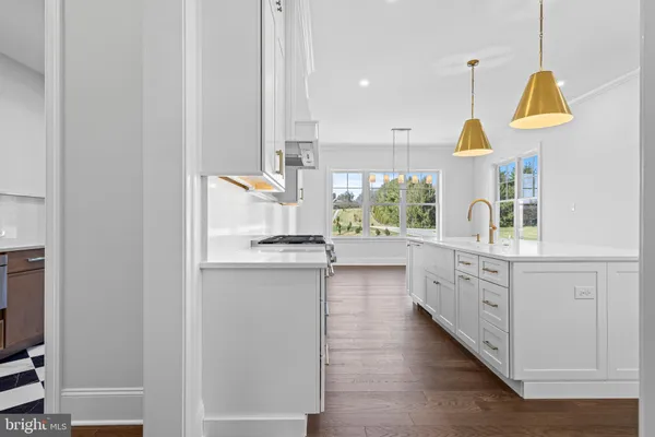 a kitchen with cabinets a sink and appliances