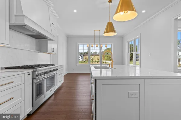 a kitchen with a stove and a sink
