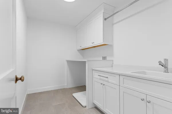 a bathroom with a sink and vanity