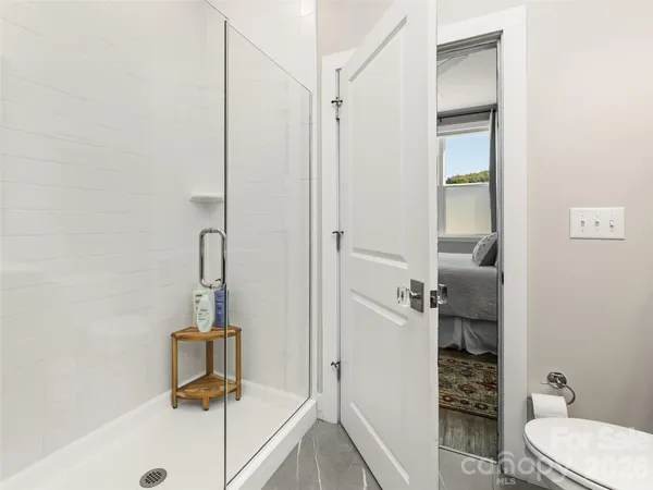 a view of entryway with wooden floor and a rug