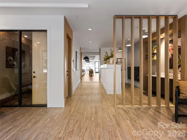 a dining room with furniture and wooden floor