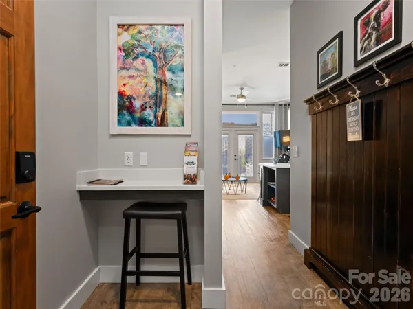 a view of kitchen island with furniture and wooden floor