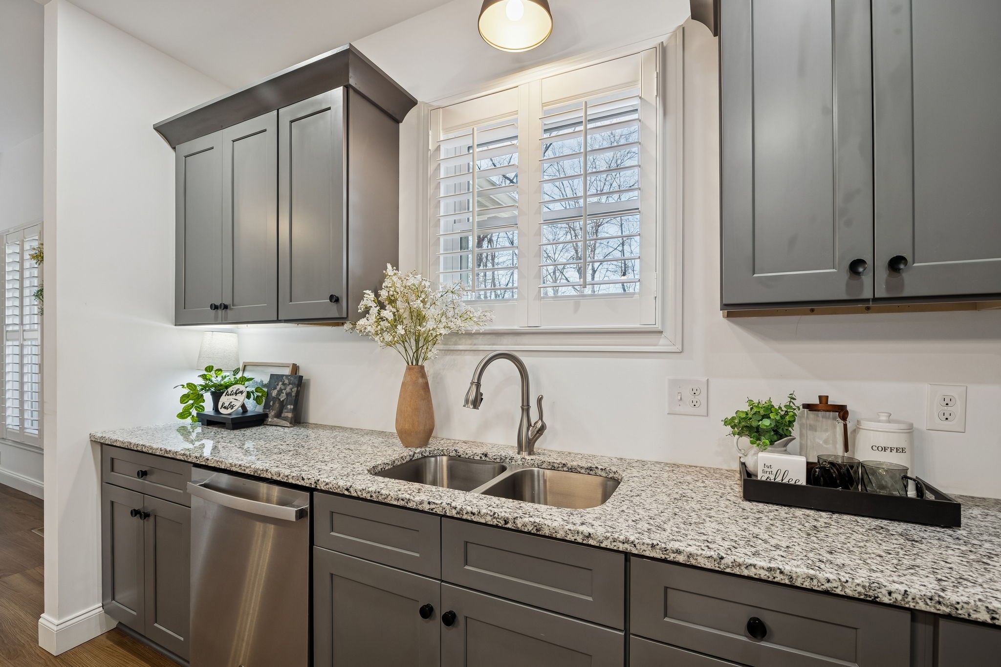 261 Lake Louisa Loop Monteagle, TN 37356 - Photo 18 of 49 a kitchen with granite countertop stainless steel appliances sink window and potted plant