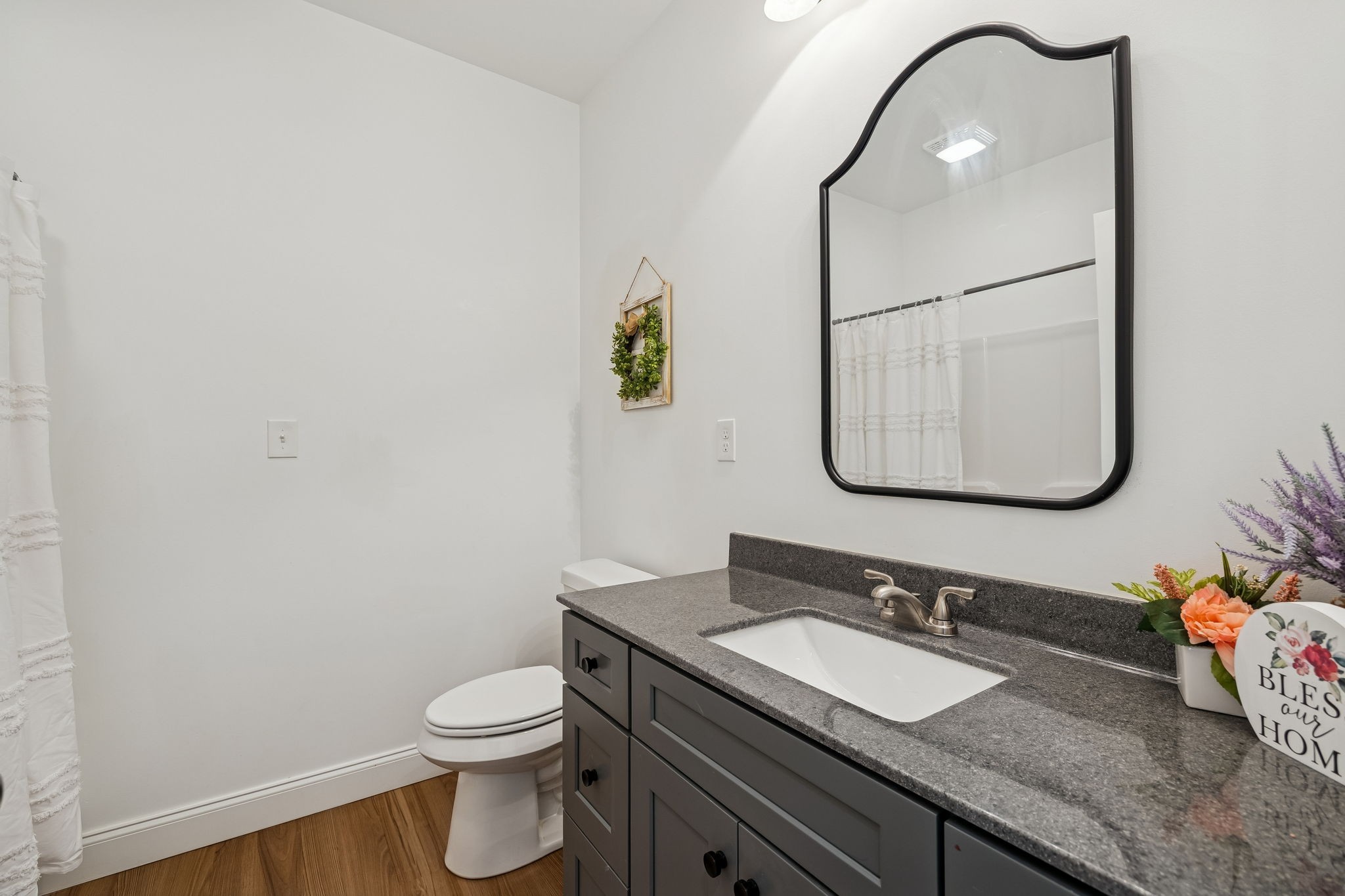 261 Lake Louisa Loop Monteagle, TN 37356 - Photo 30 of 49 a bathroom with a granite countertop sink mirror and toilet