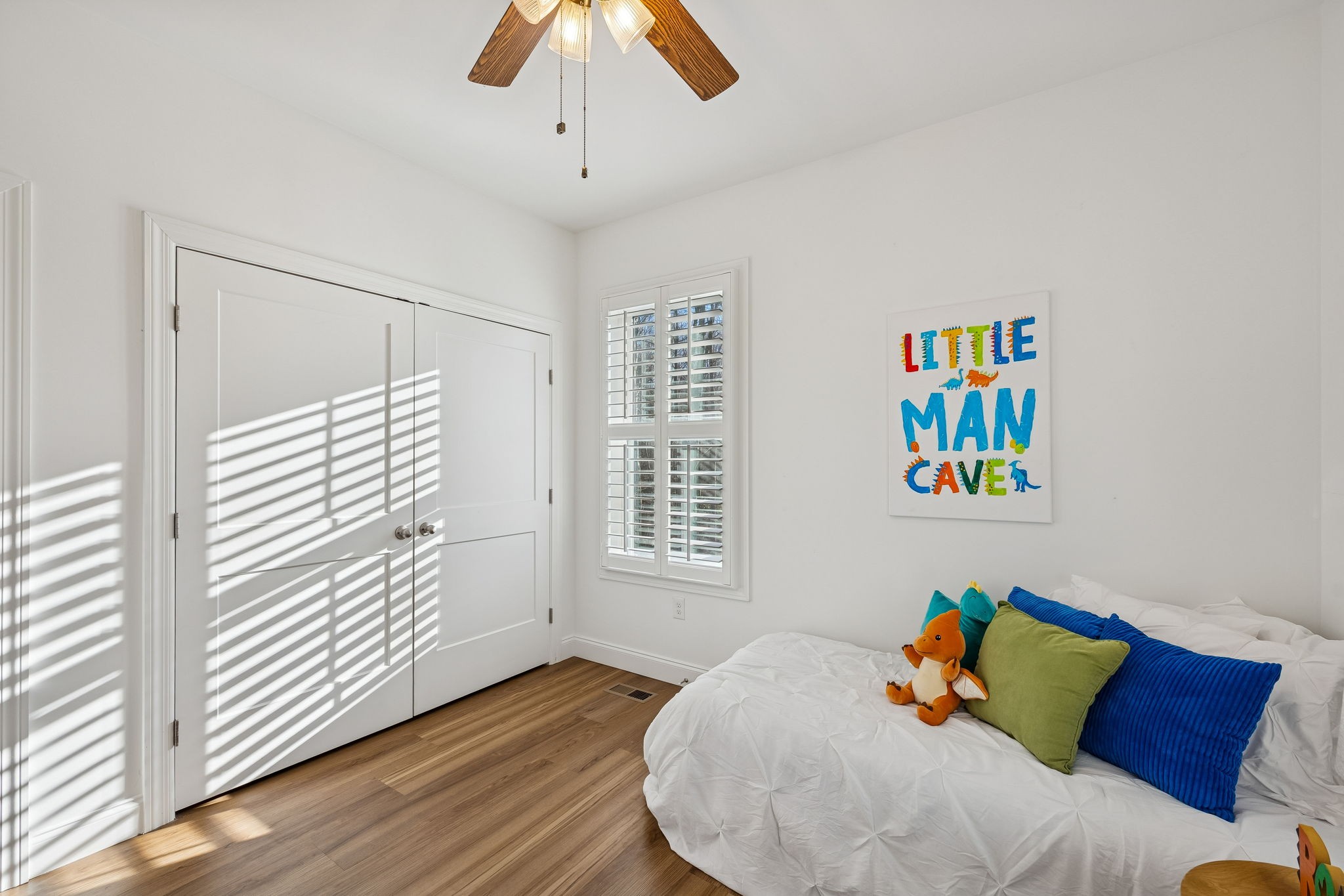 261 Lake Louisa Loop Monteagle, TN 37356 - Photo 32 of 49 a bed sitting in a bedroom next to a window