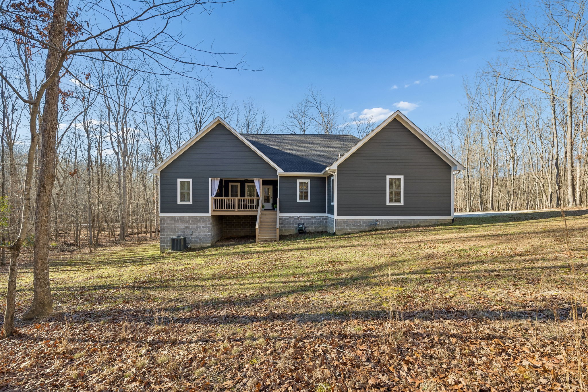 261 Lake Louisa Loop Monteagle, TN 37356 - Photo 37 of 49 a front view of a house with a yard