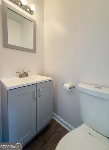a bathroom with a sink and mirror