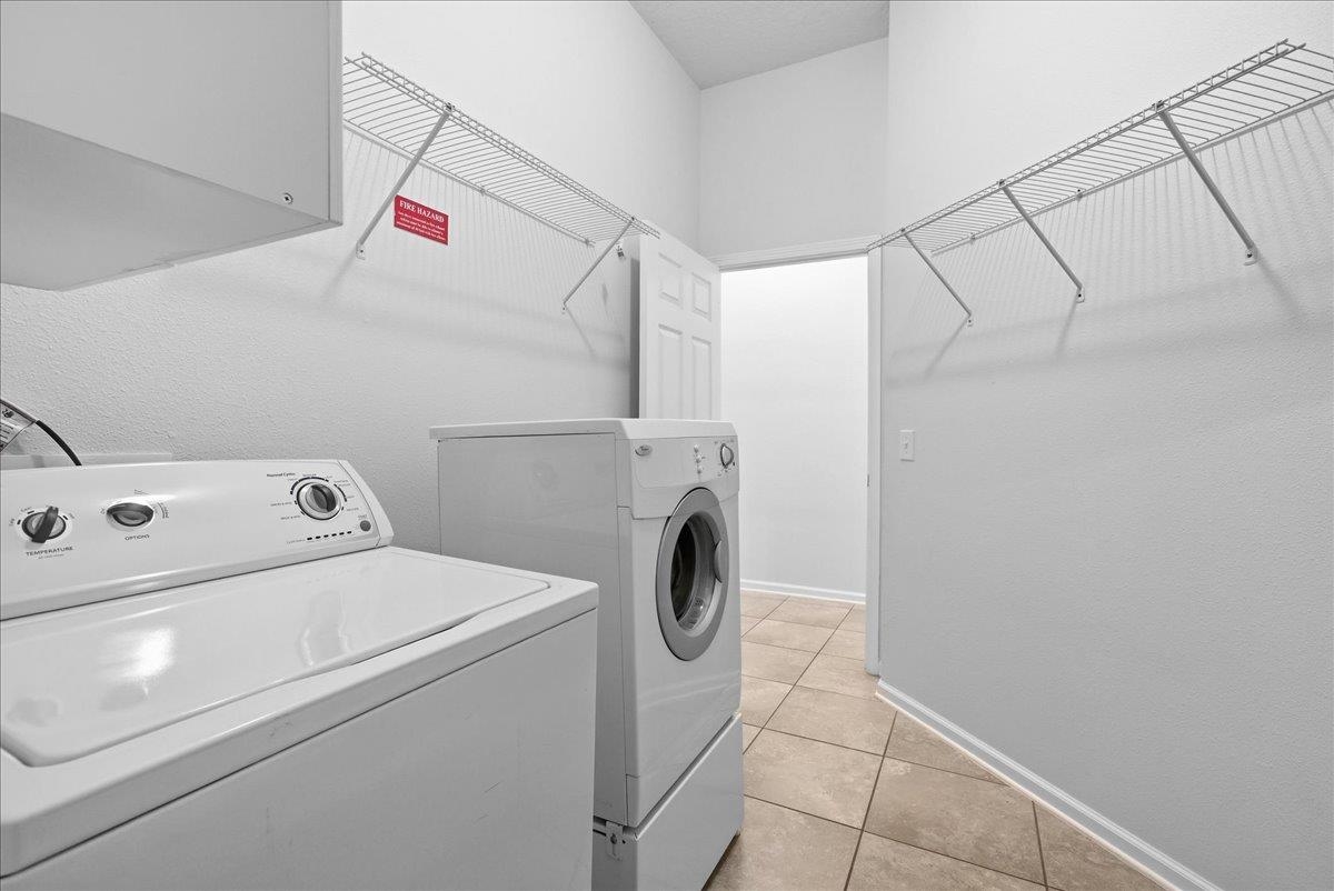 1112 Golden Lake Loop St. Augustine, FL 32084 - Photo 13 of 56 a utility room with dryer and washer