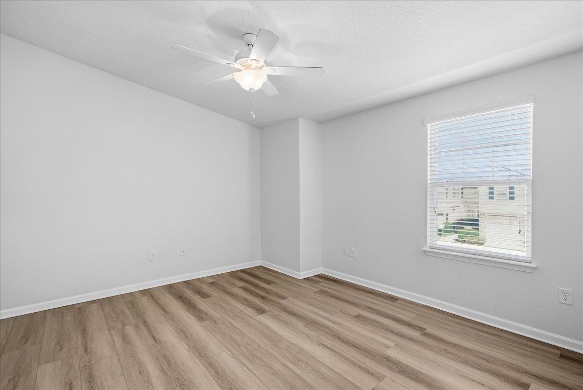 1112 Golden Lake Loop St. Augustine, FL 32084 - Photo 15 of 56 wooden floor in an empty room with a window
