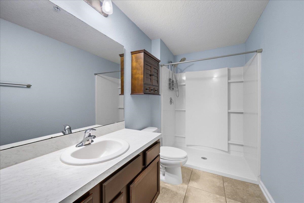1112 Golden Lake Loop St. Augustine, FL 32084 - Photo 26 of 56 a bathroom with a sink toilet and shower