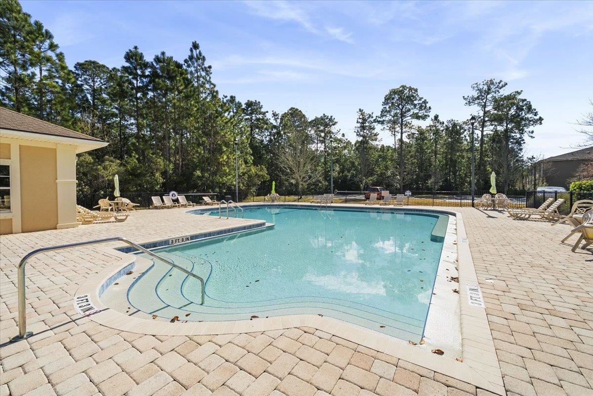 1112 Golden Lake Loop St. Augustine, FL 32084 - Photo 47 of 56 a view of a swimming pool with a patio