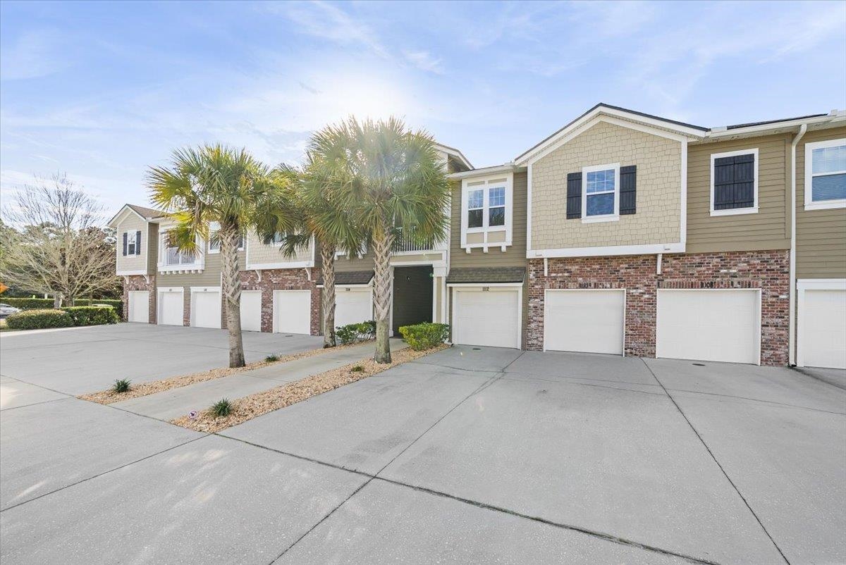 1112 Golden Lake Loop St. Augustine, FL 32084 - Photo 5 of 56 a view of a house with a yard and garage