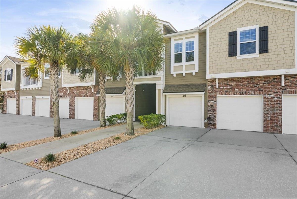 1112 Golden Lake Loop St. Augustine, FL 32084 - Photo 6 of 56 a front view of a house with a yard and garage
